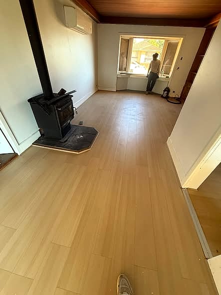 Finished timber floor by the wood heater
